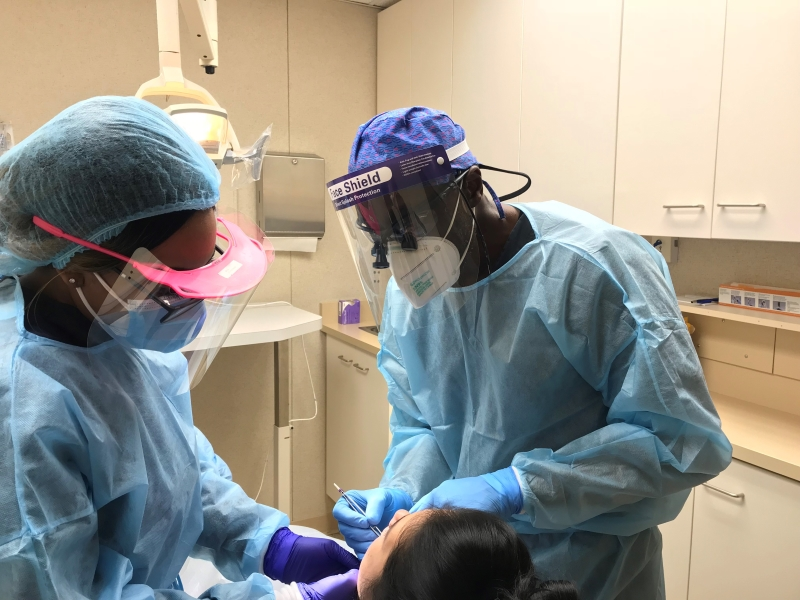 oral surgeon and his team performing a procedure